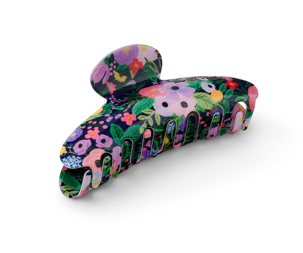 Colorful floral-patterned hair clip on a white background