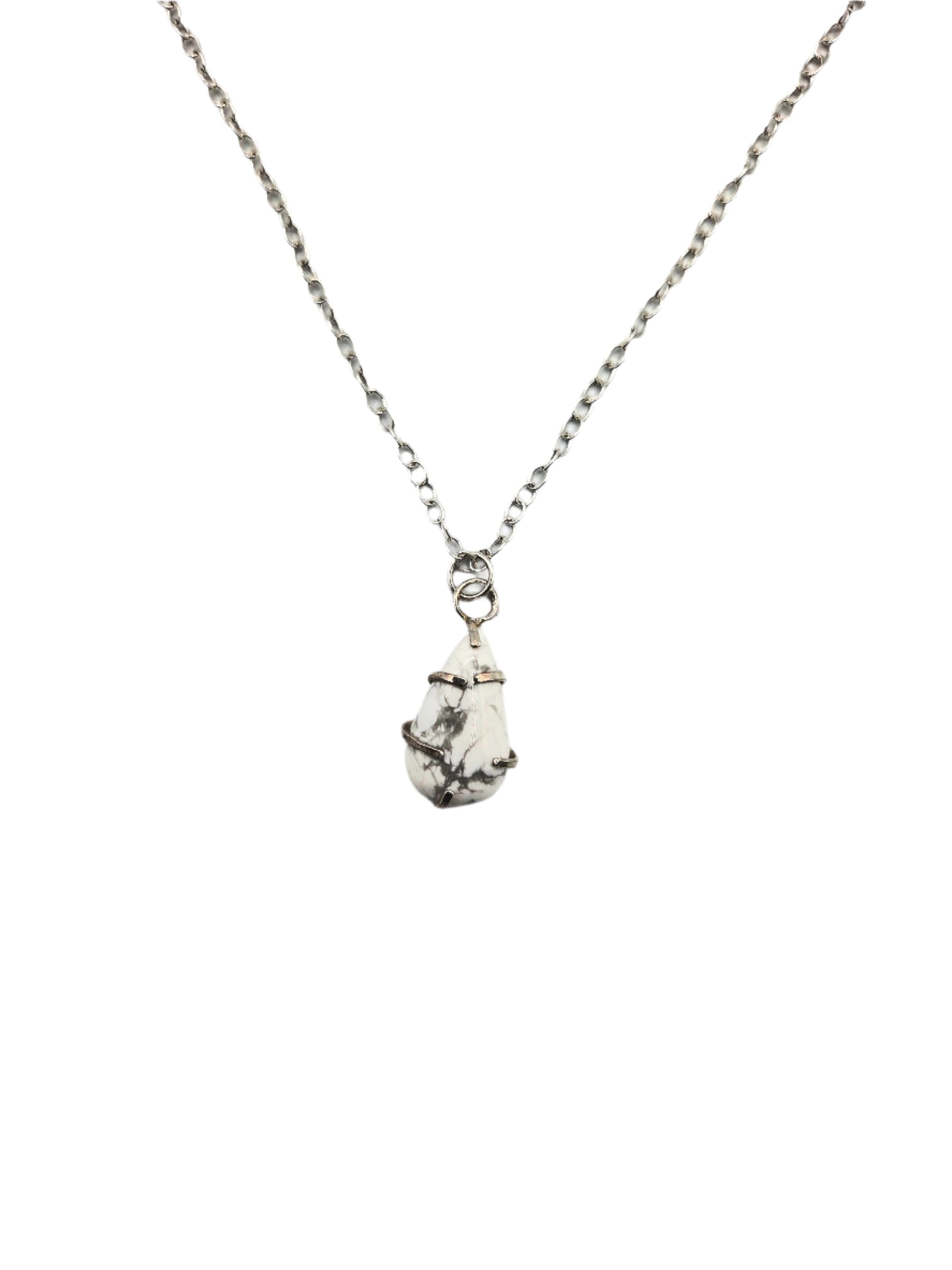 Silver necklace with a white teardrop-shaped pendant on a white background