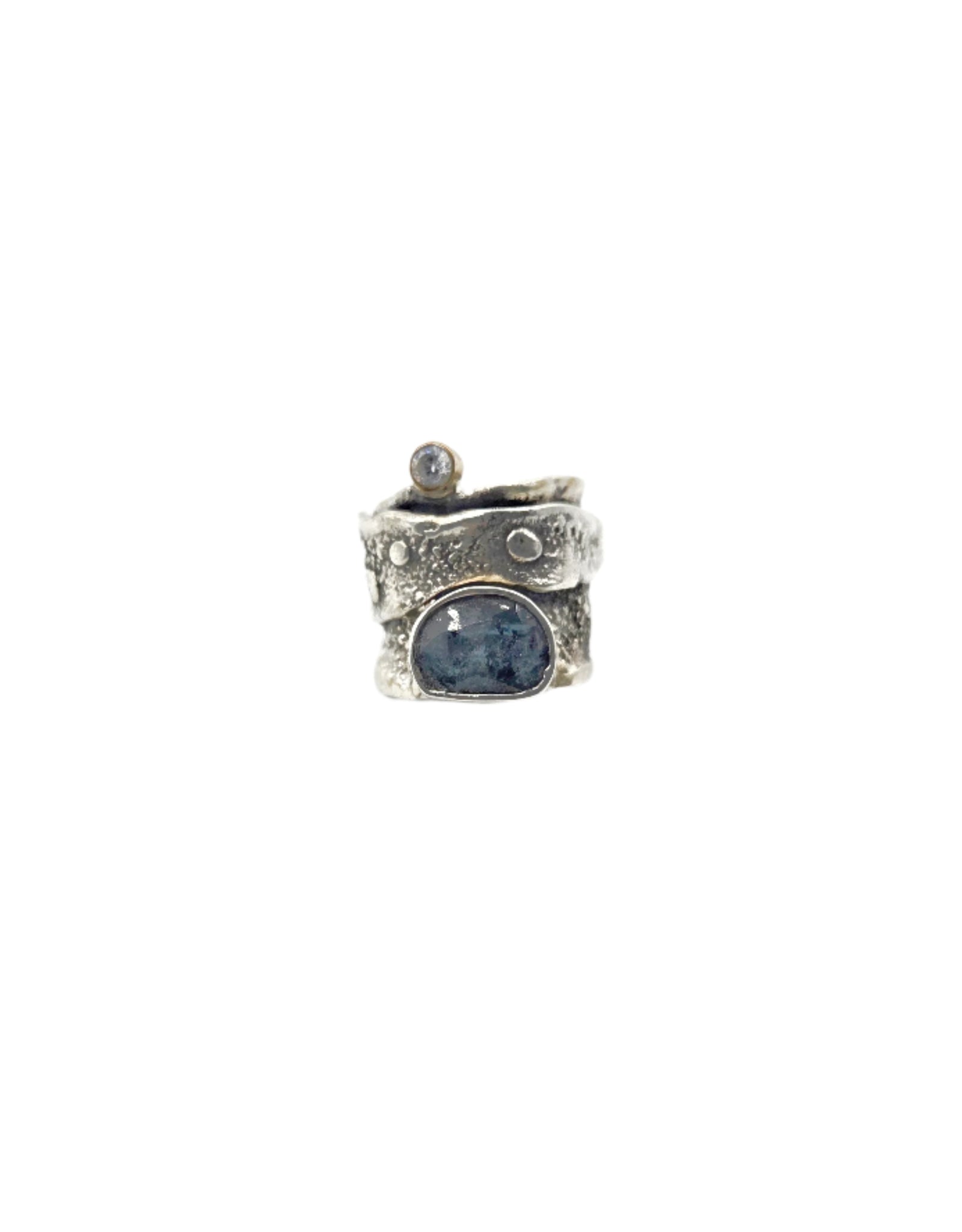 Silver ring with a blue gemstone on a white background