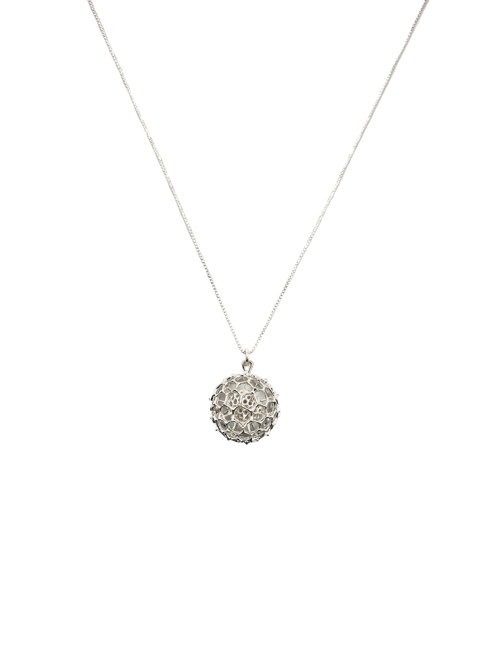 Silver necklace with a textured pendant on a white background