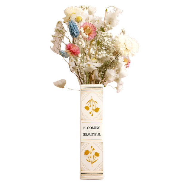 Vase with flowers labeled 'Blooming Beautiful' on a beige background