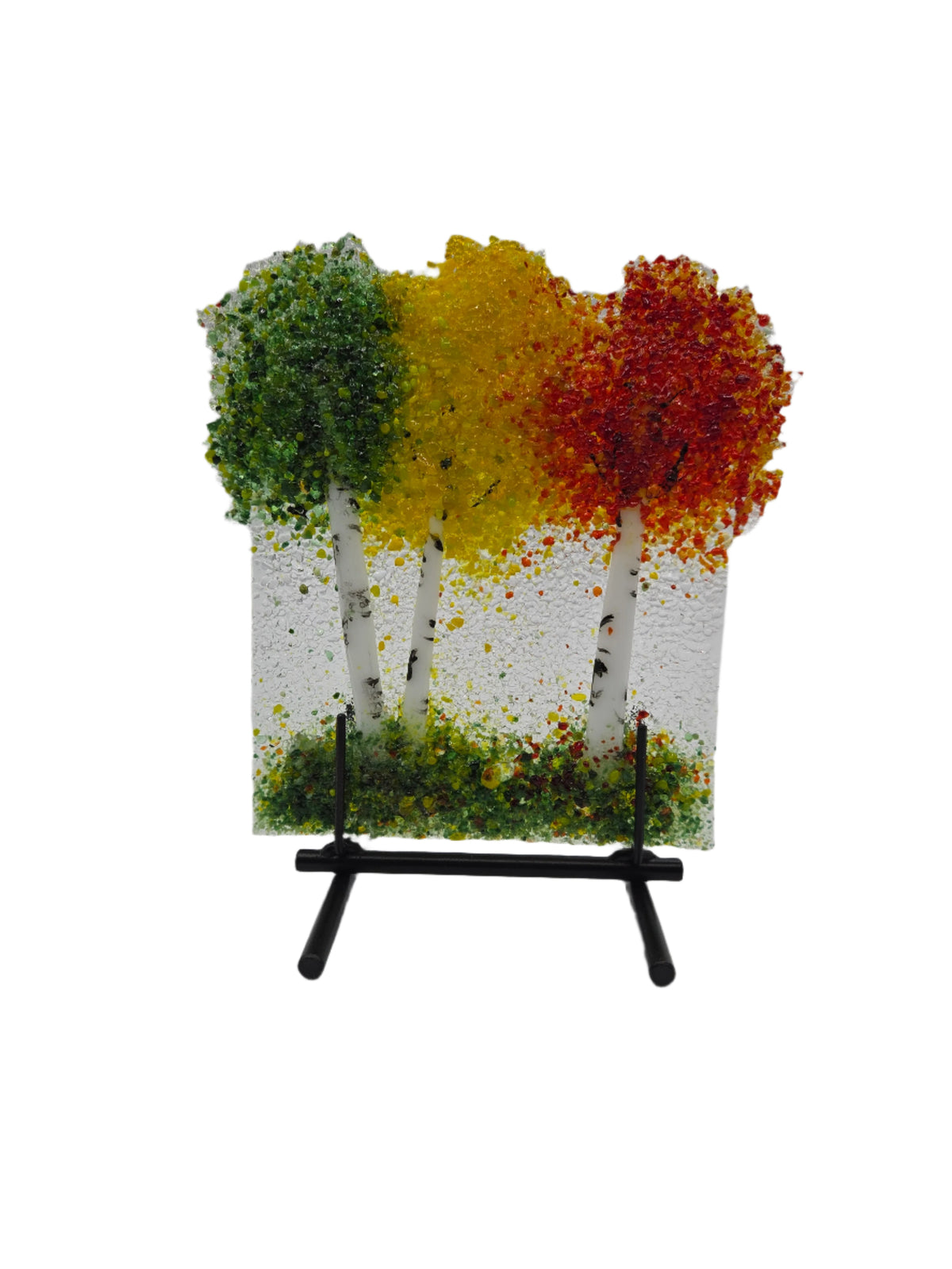 Decorative glass piece with green, yellow &amp; red trees on a stand 