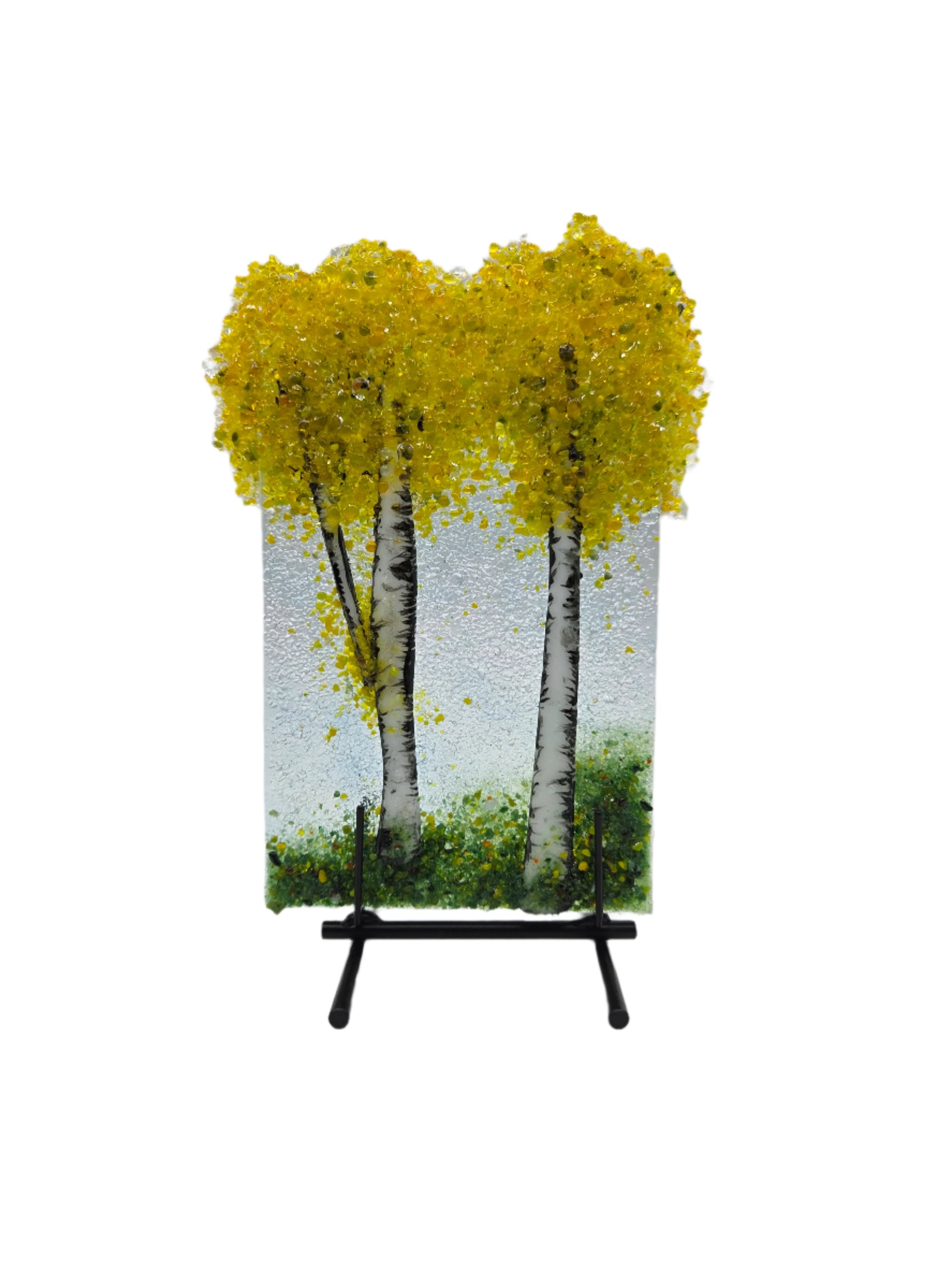 Decorative glass piece with yellow trees on a stand 