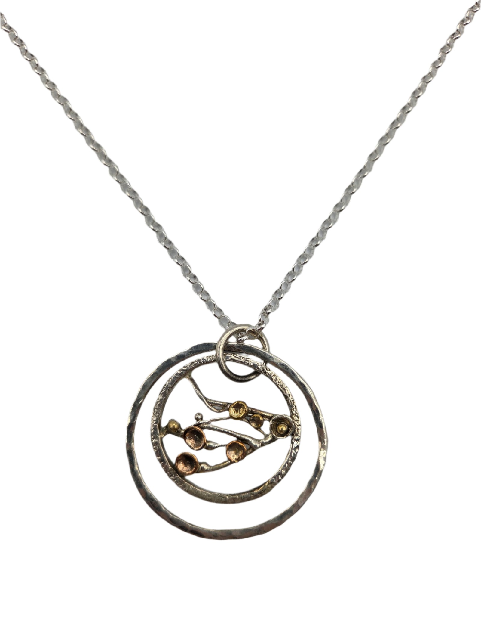 Silver necklace with a circular pendant 