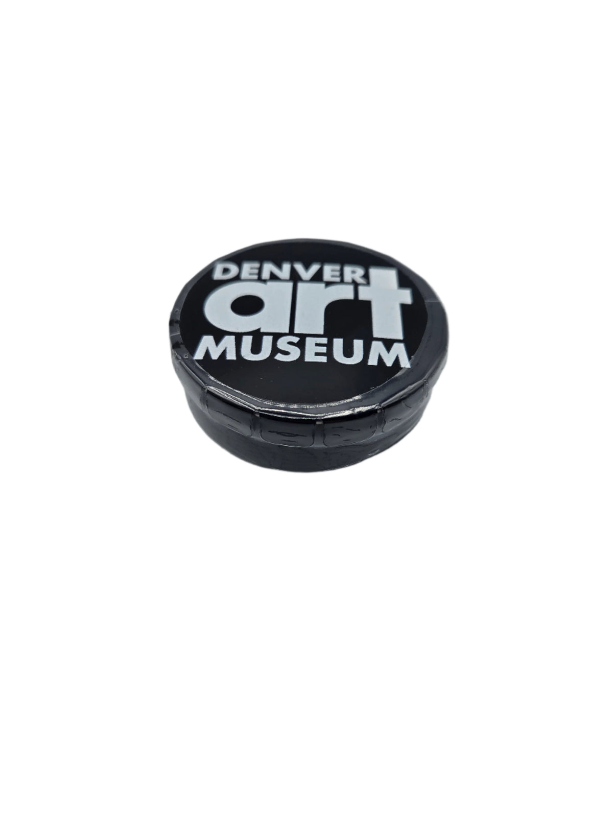 Denver Art Museum logo on a black circular tin