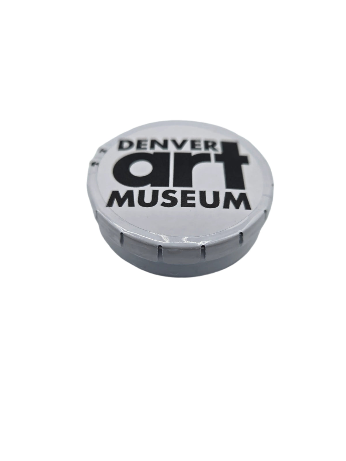 Denver Art Museum logo on a round white tin