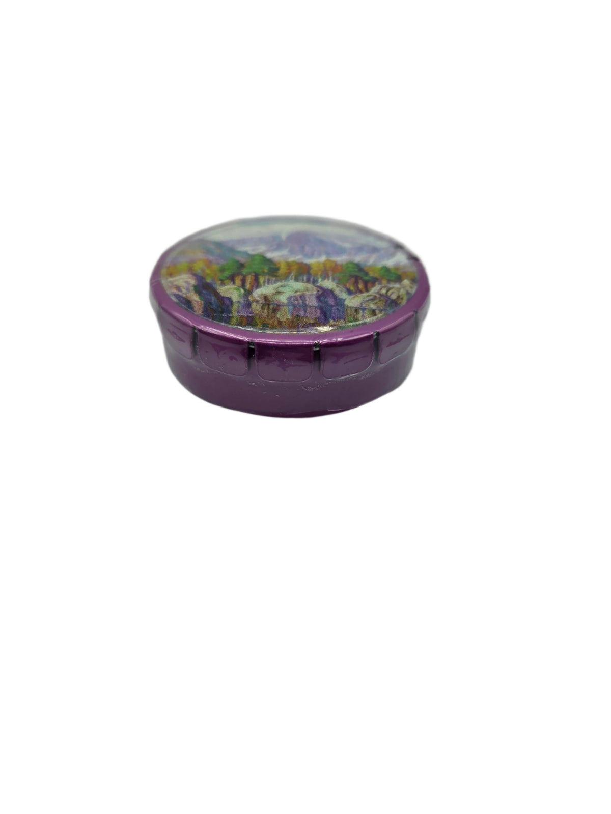 side view of mint tin with a mountain symphony painting