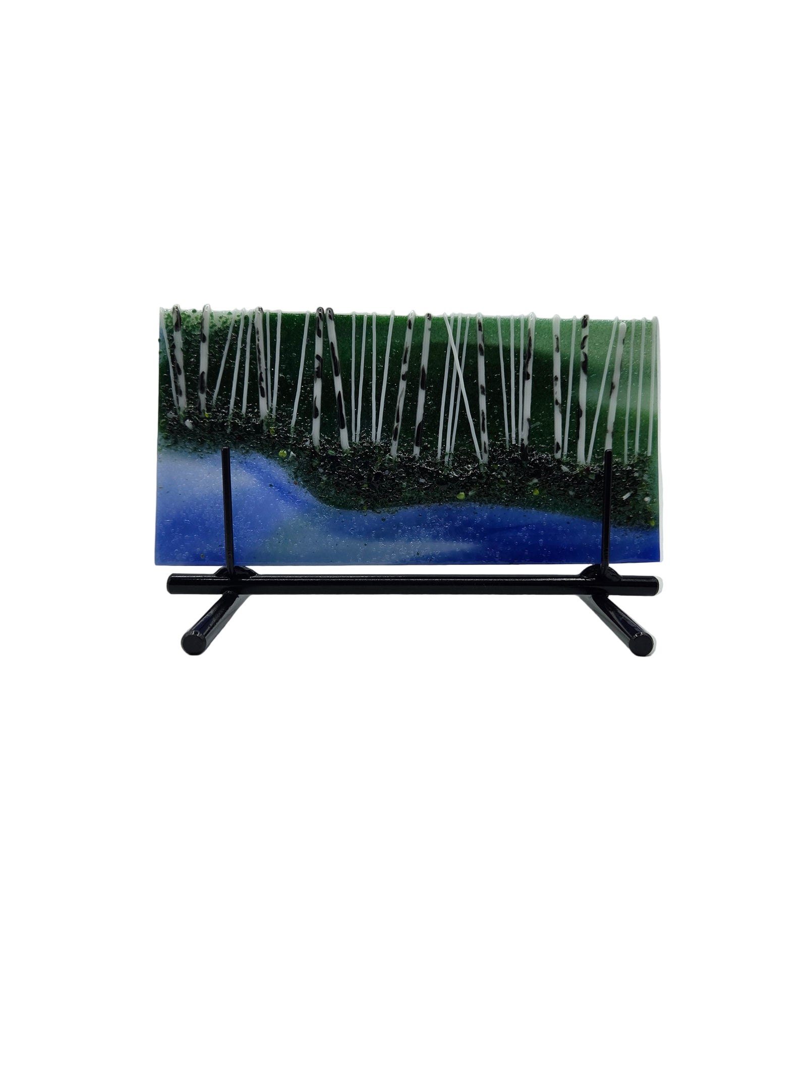 Blue and green fused glass art with black metal stand on a white background