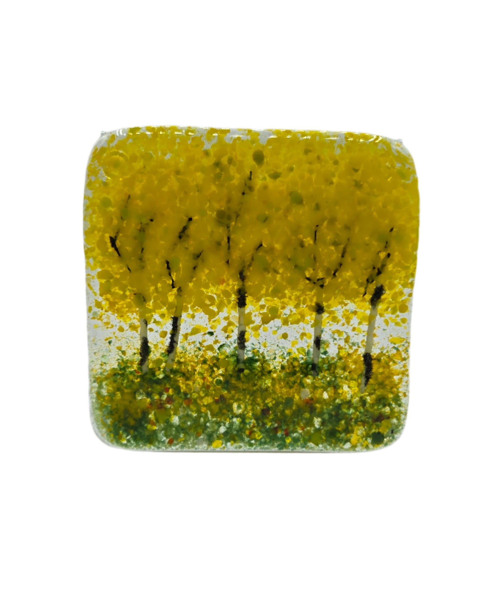 Decorative glass coaster with yellow trees on a white background
