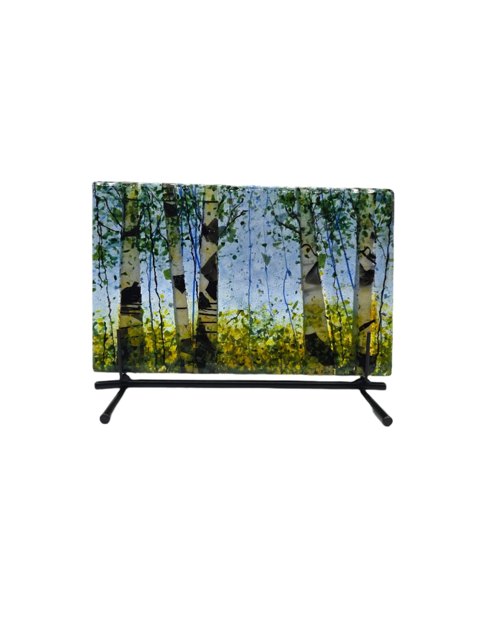 Decorative glass with green yellow trees on a blue background