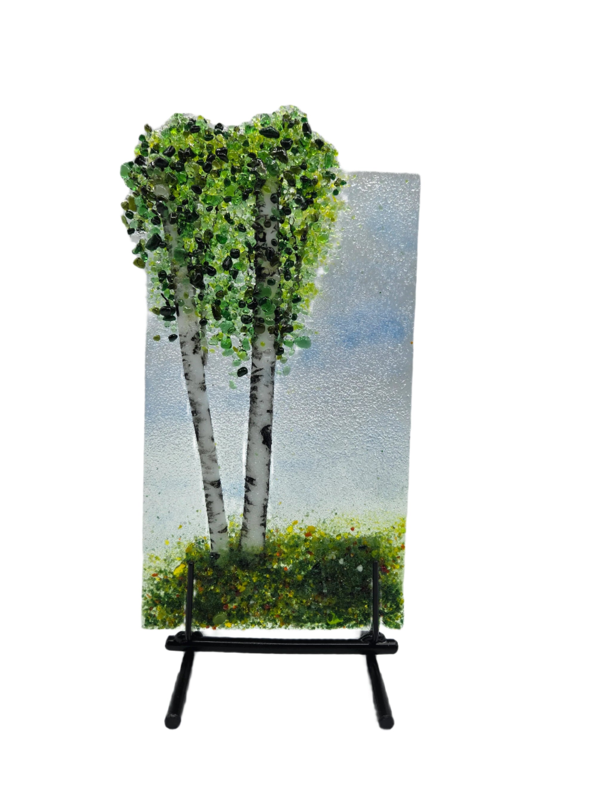 Decorative glass with green trees on a white background