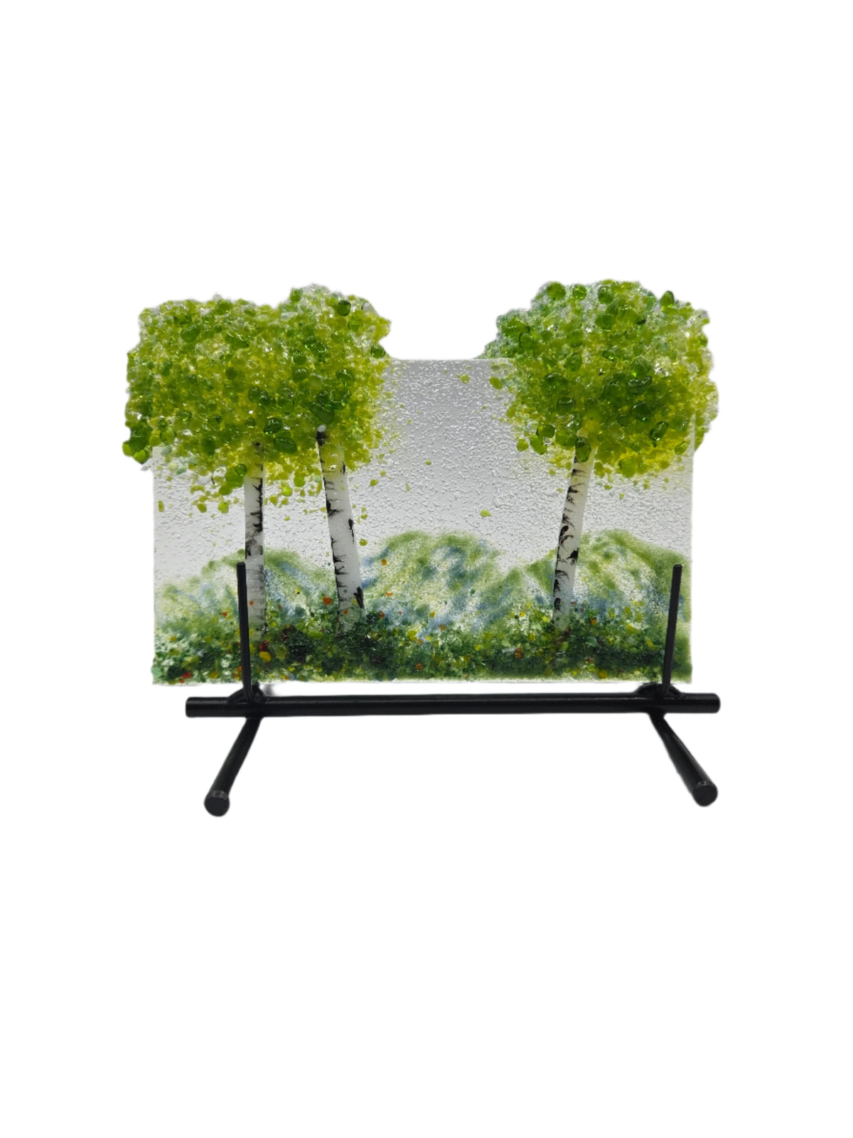 Decorative glass with green trees on a white background