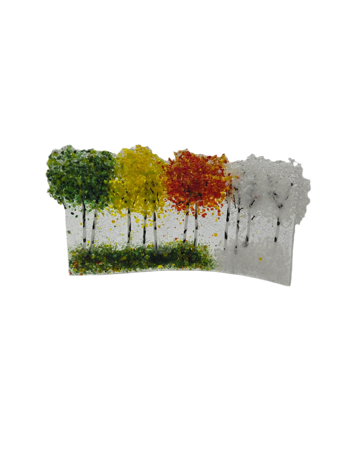 Decorative glass with green, yellow, red and white trees on a white background