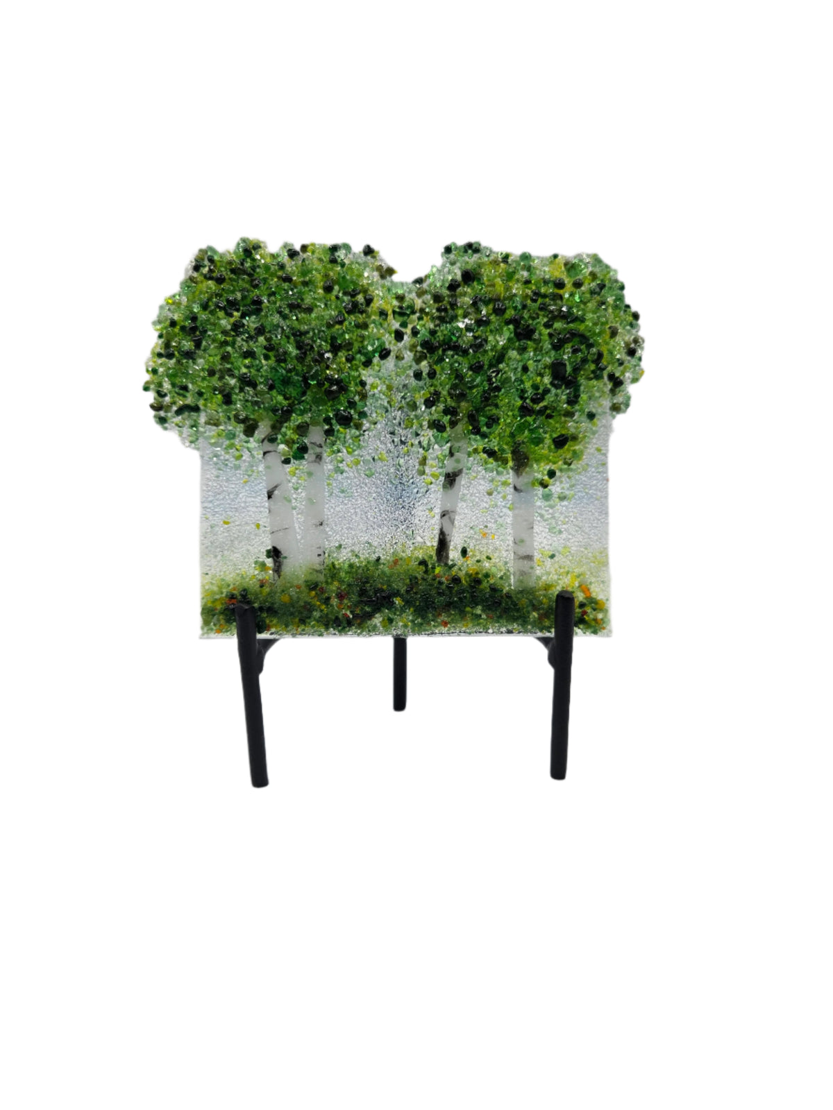 Decorative glass with green trees on a white background