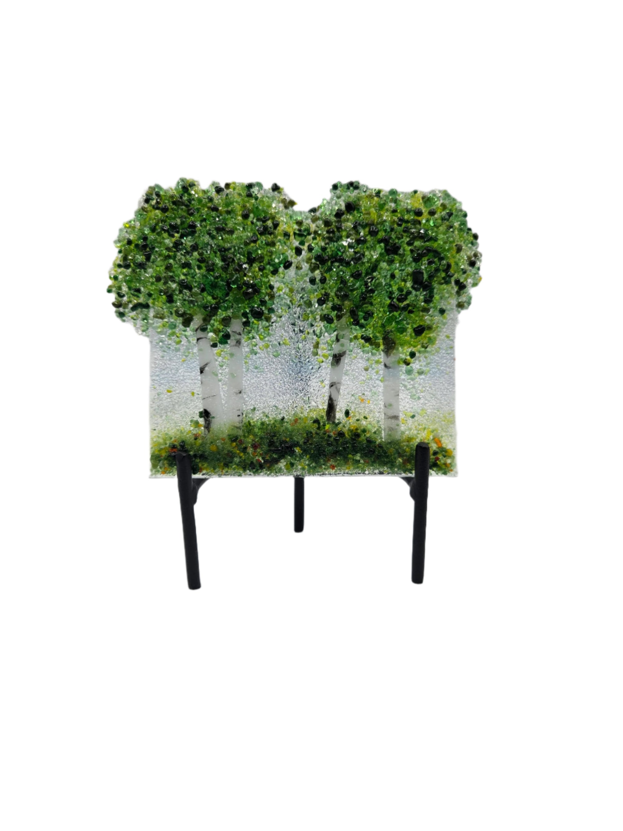Decorative glass with green trees on a white background