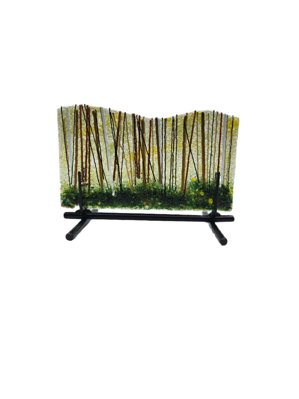 Decorative glass piece with a black metal stand and greenery forest design on a white background