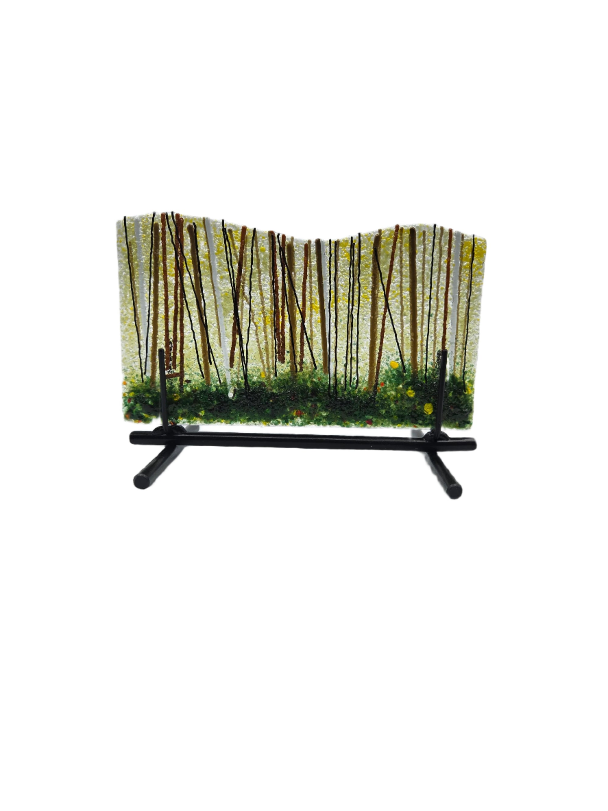 Decorative glass piece with a black metal stand and greenery forest design on a white background