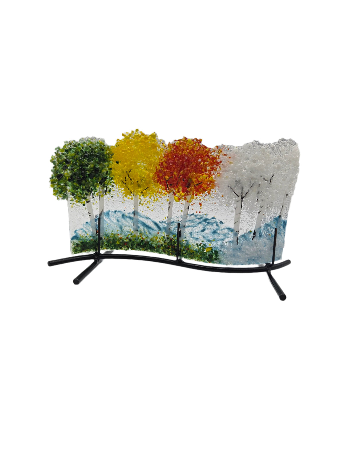 Decorative glass with green, yellow, red and white trees on a white background