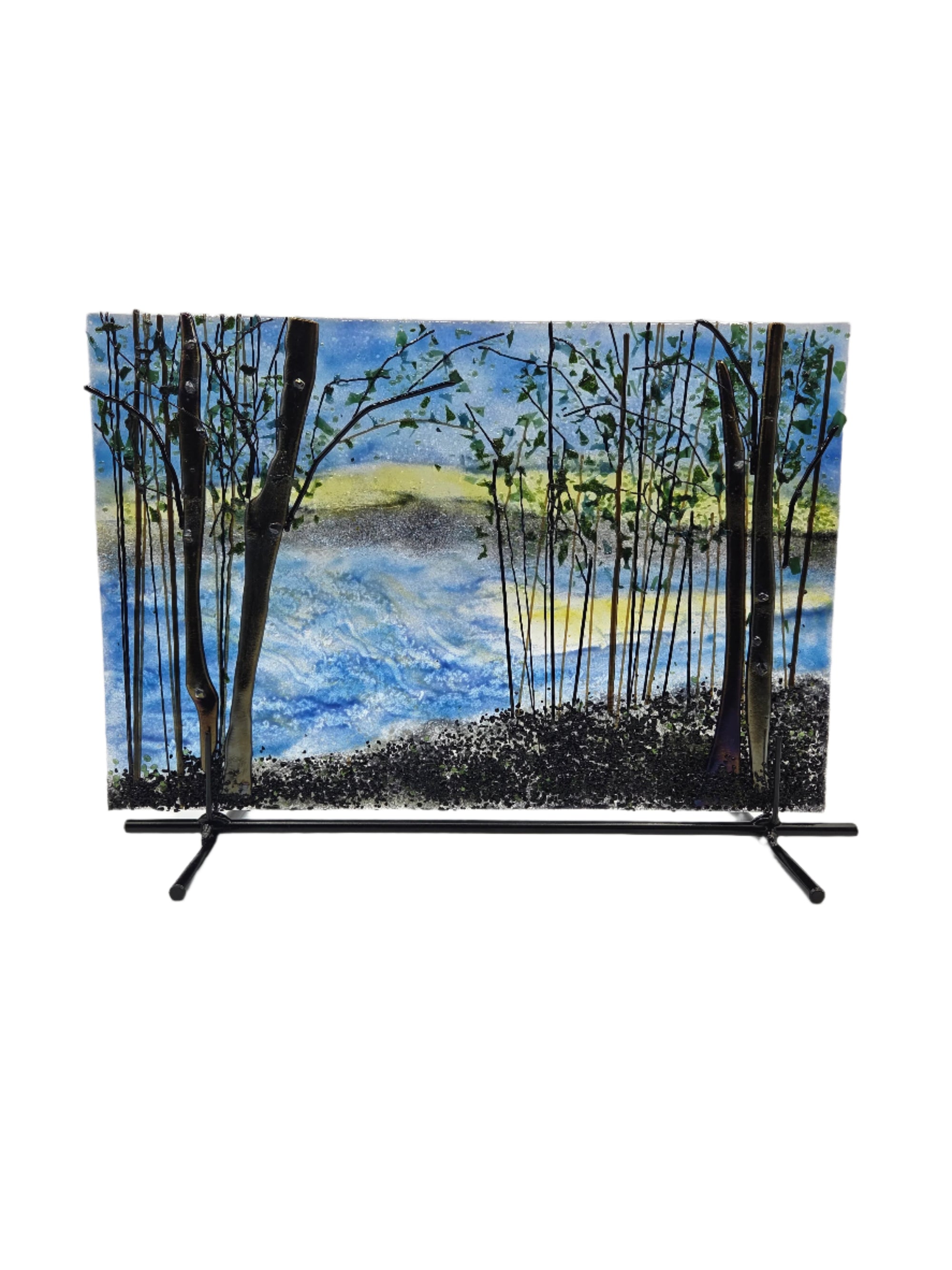 Trees surrounding a lake glass panel with metal stand