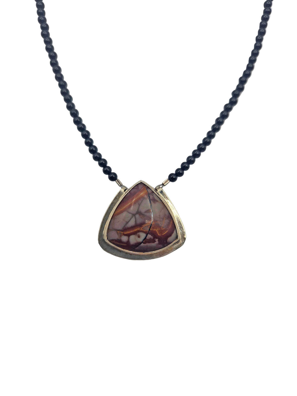 Necklace with a triangular brown stone pendant on a white background