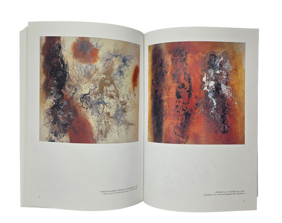 Open book displaying red and orange abstract art 