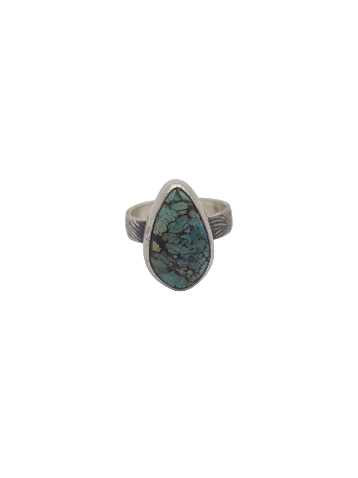 Silver ring with a turquoise stone on a light gray background