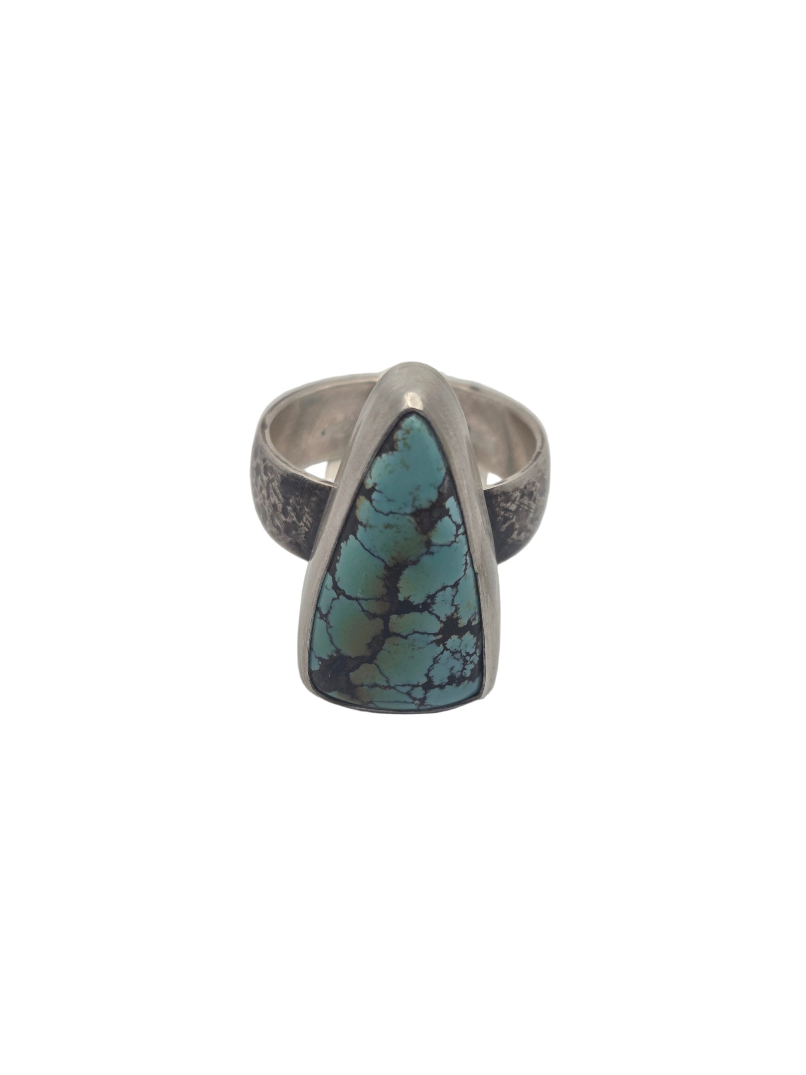 Silver ring with a turquoise stone on a light gray background