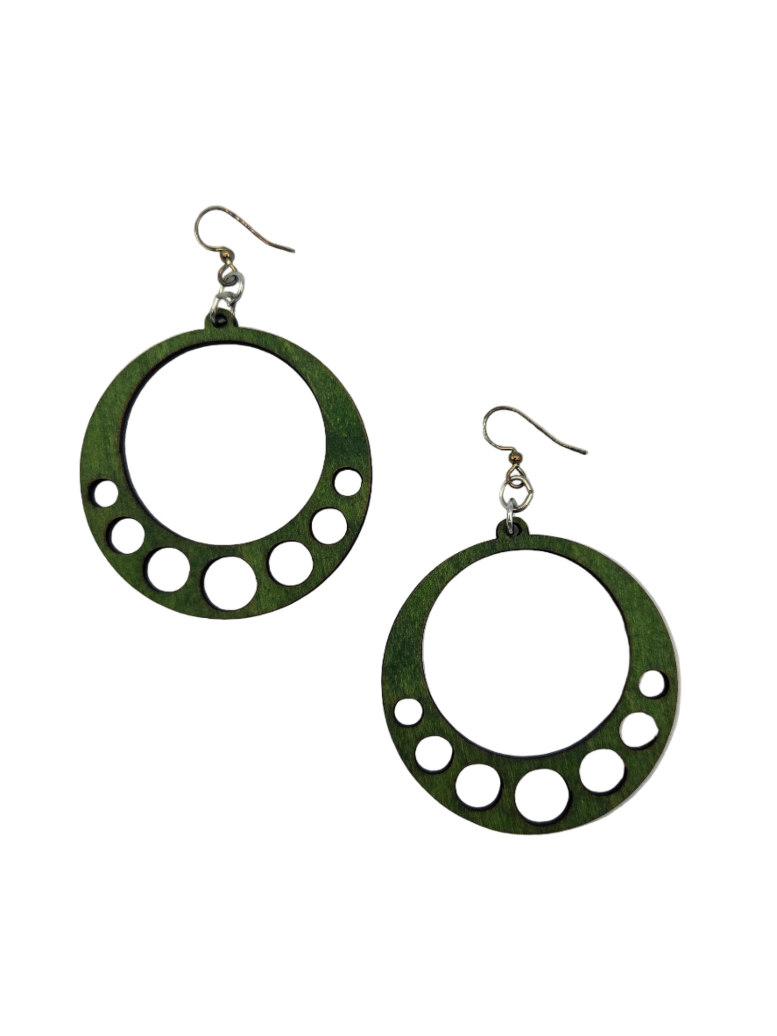 Green circular earrings with cut-out designs on a white background
