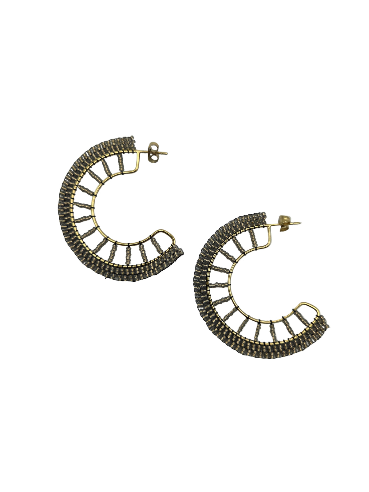 Pair of gold and silver hoop earrings on a white background