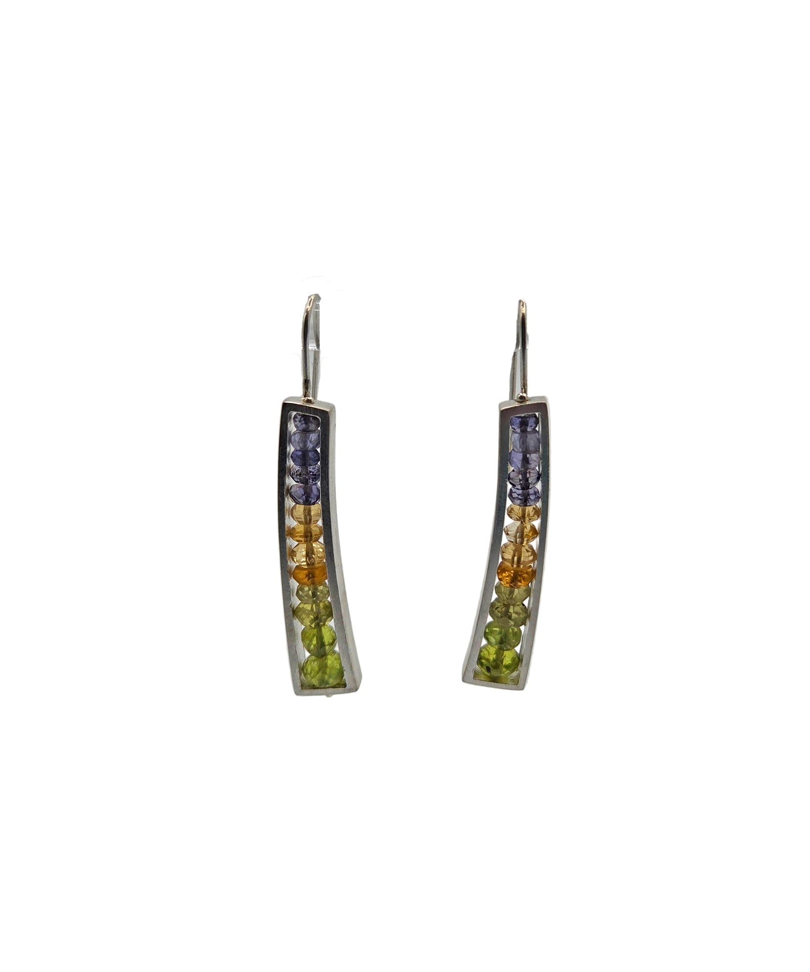 Pair of curved earrings with colorful gemstones on a white background