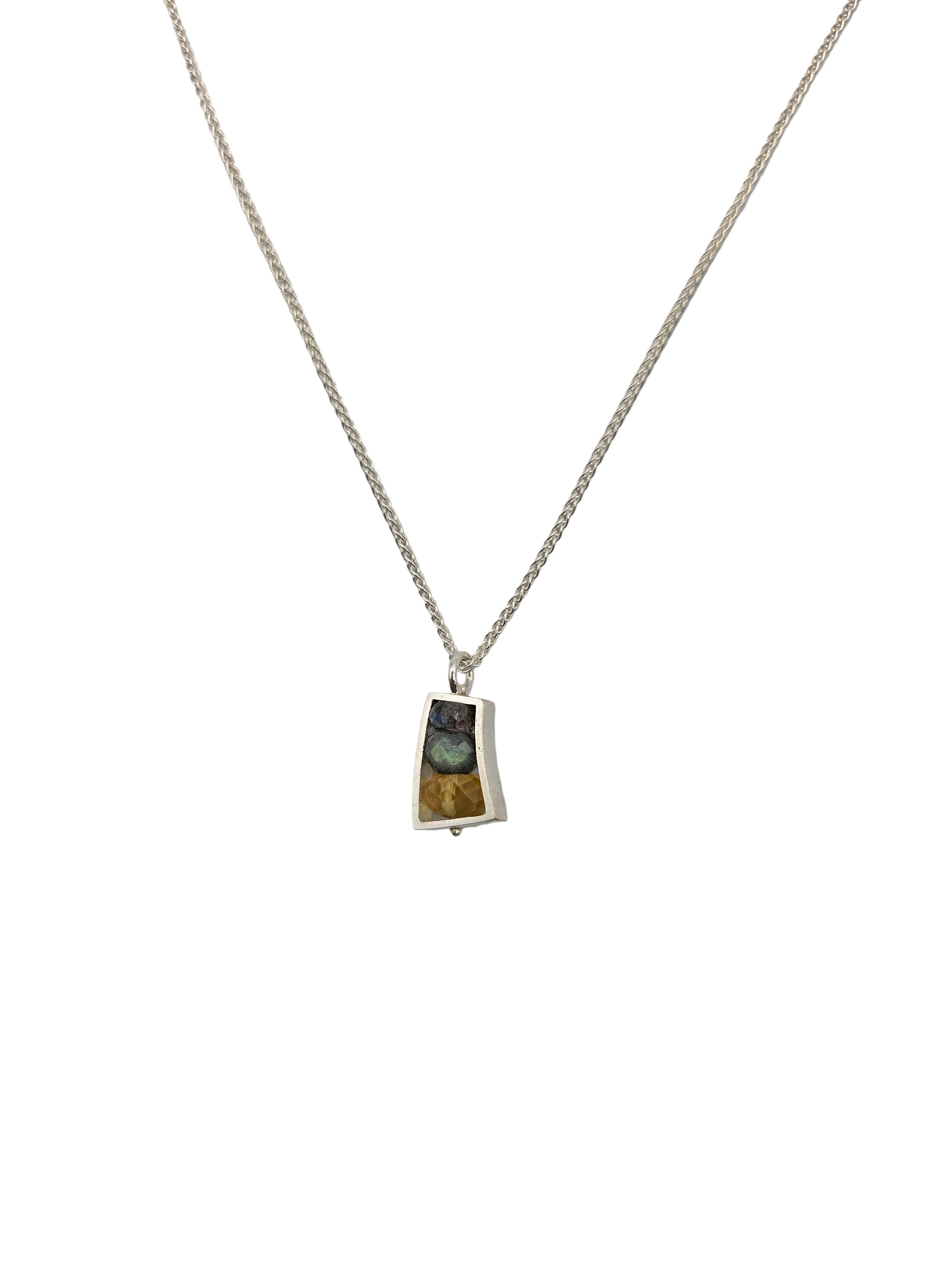 silver necklace with a 3 gemstone pendant