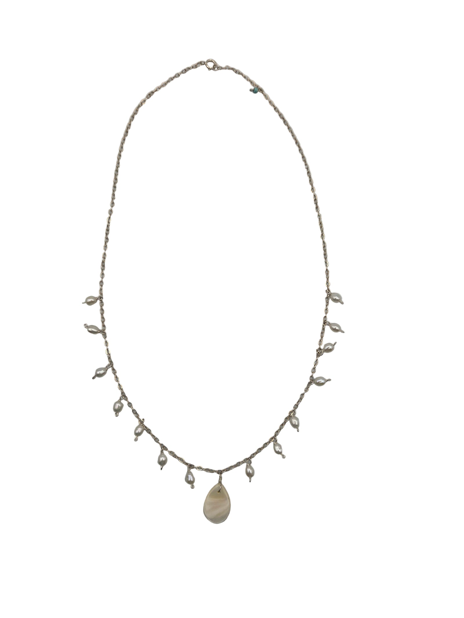 Delicate necklace with pearls on a white background