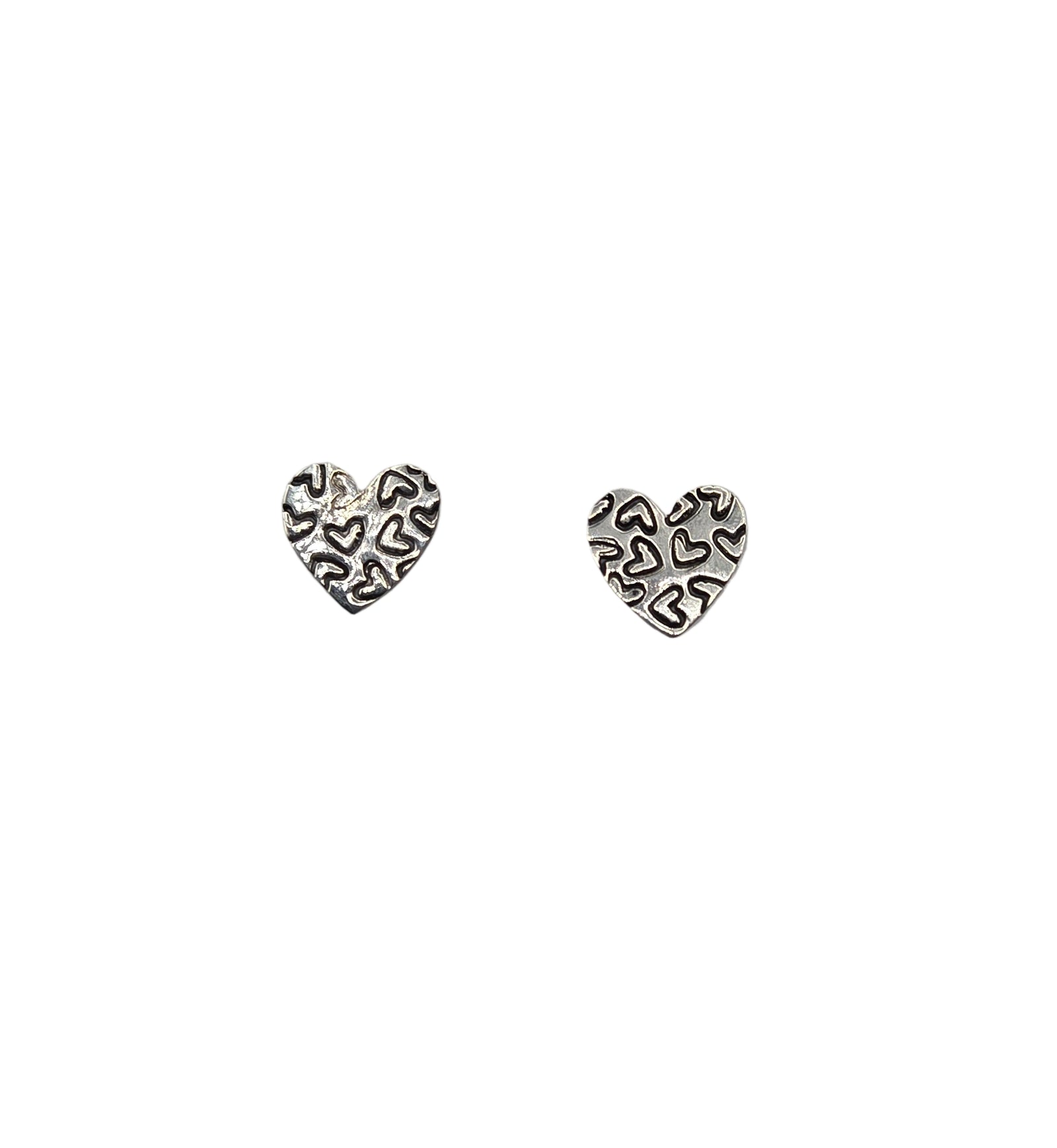 Two silver heart shaped earrings 