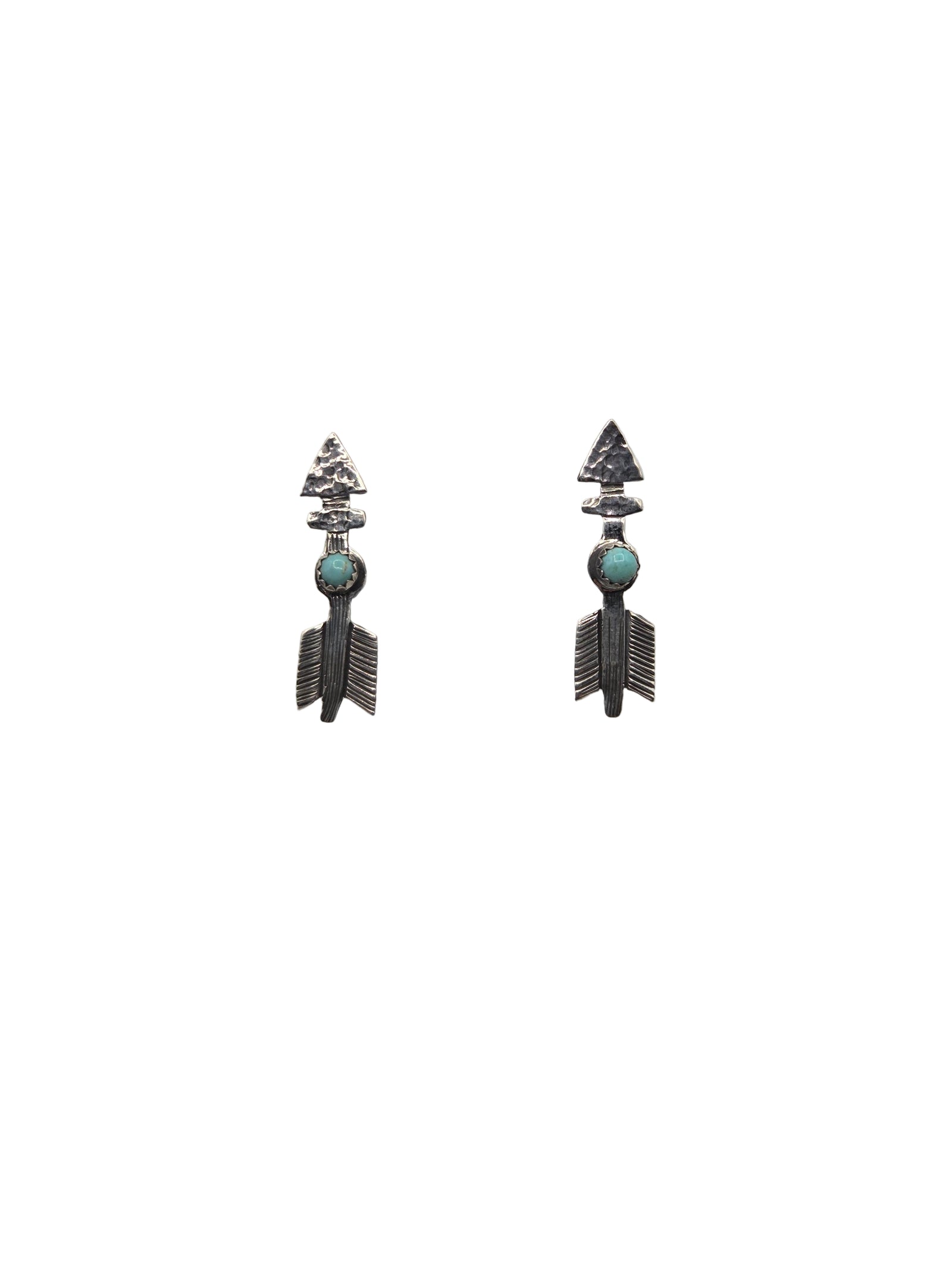 Pair of arrow-shaped earrings with turquoise stones on a white background