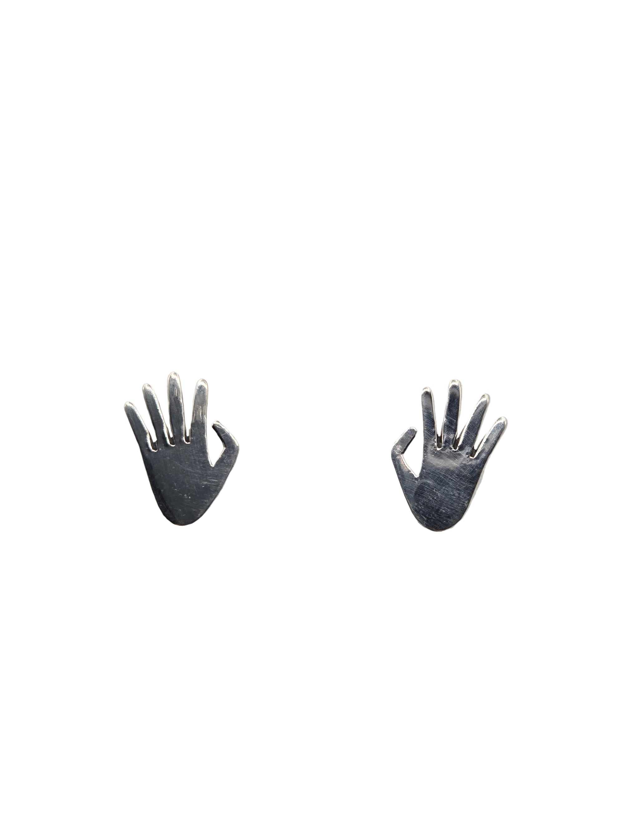 Two small silver hand-shaped earrings