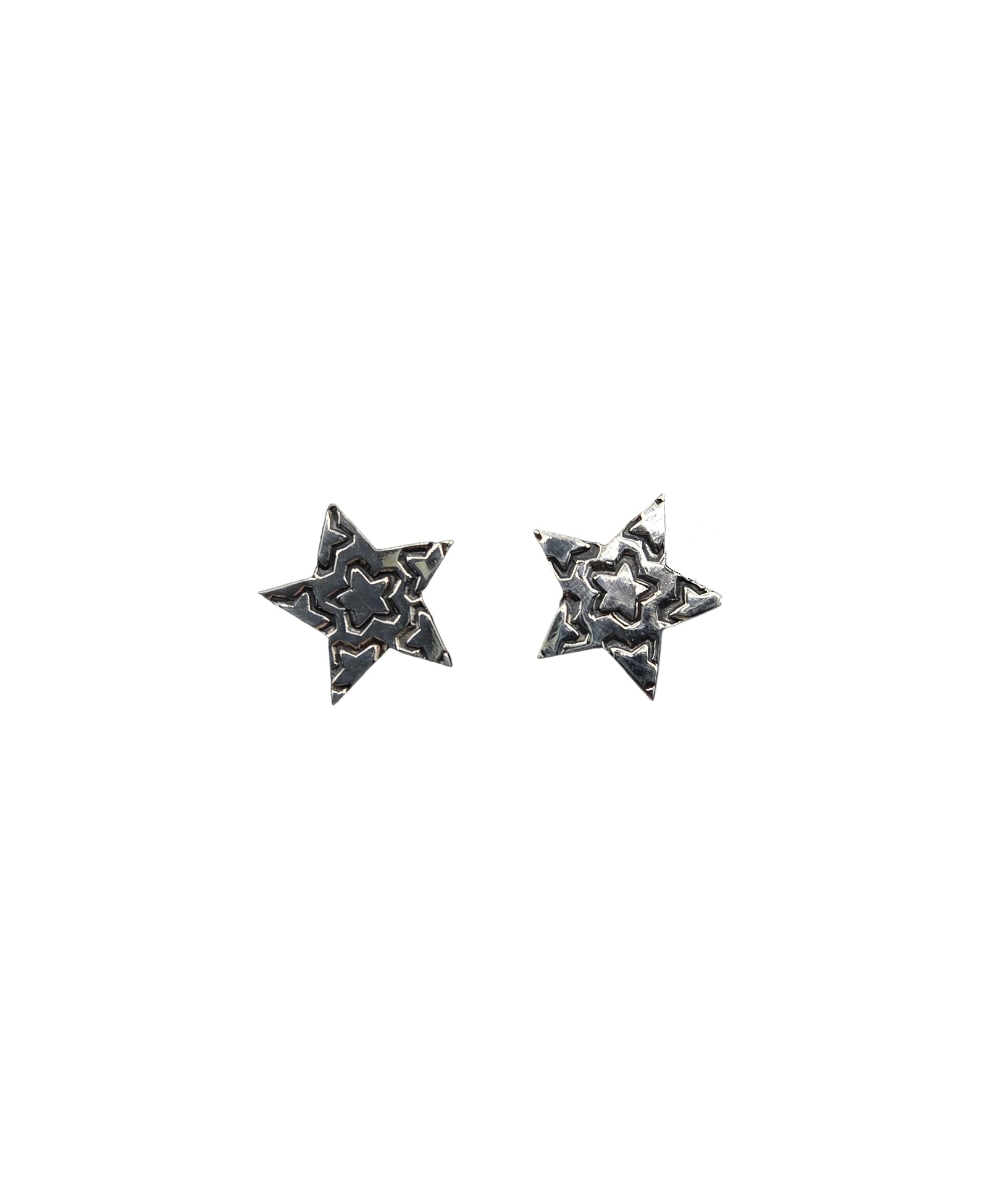 Pair of star-shaped earrings on a white background