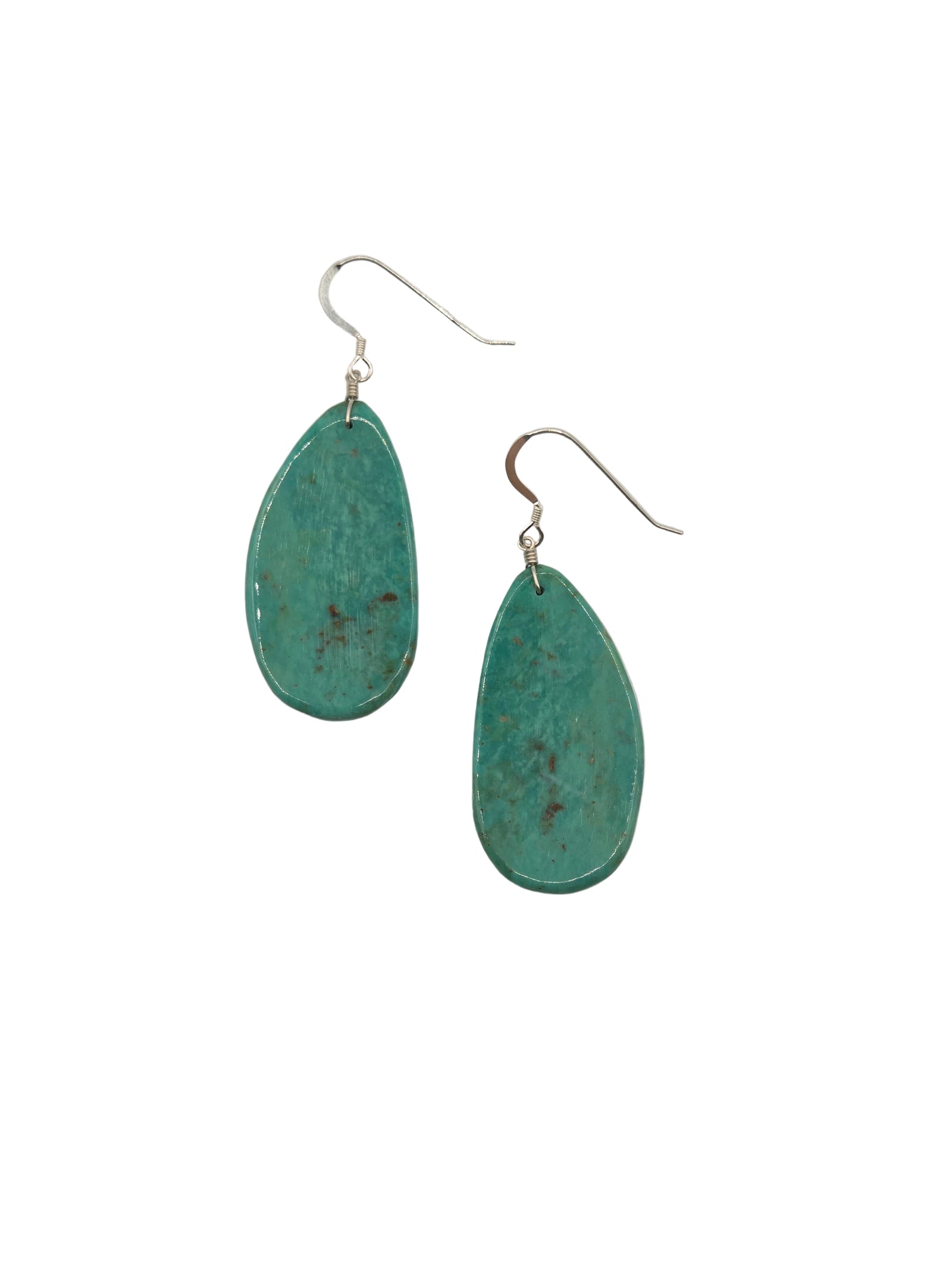Pair of turquoise earrings on a white background