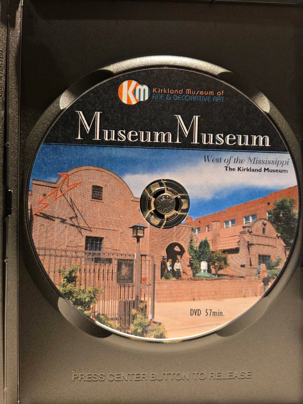 DVD case with a museum illustration and branding on a black background