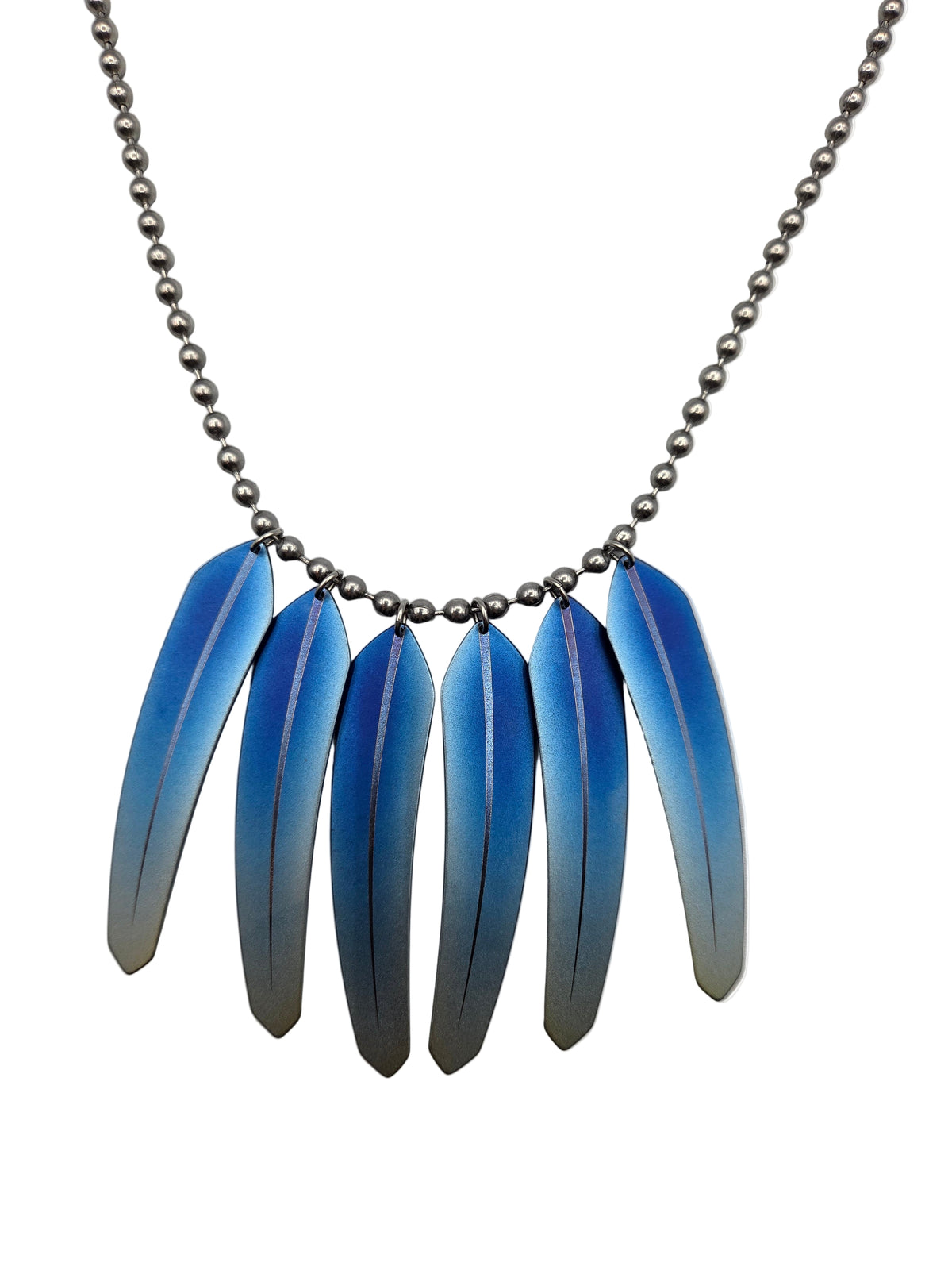 Necklace with blue feather-like pendants on a white background