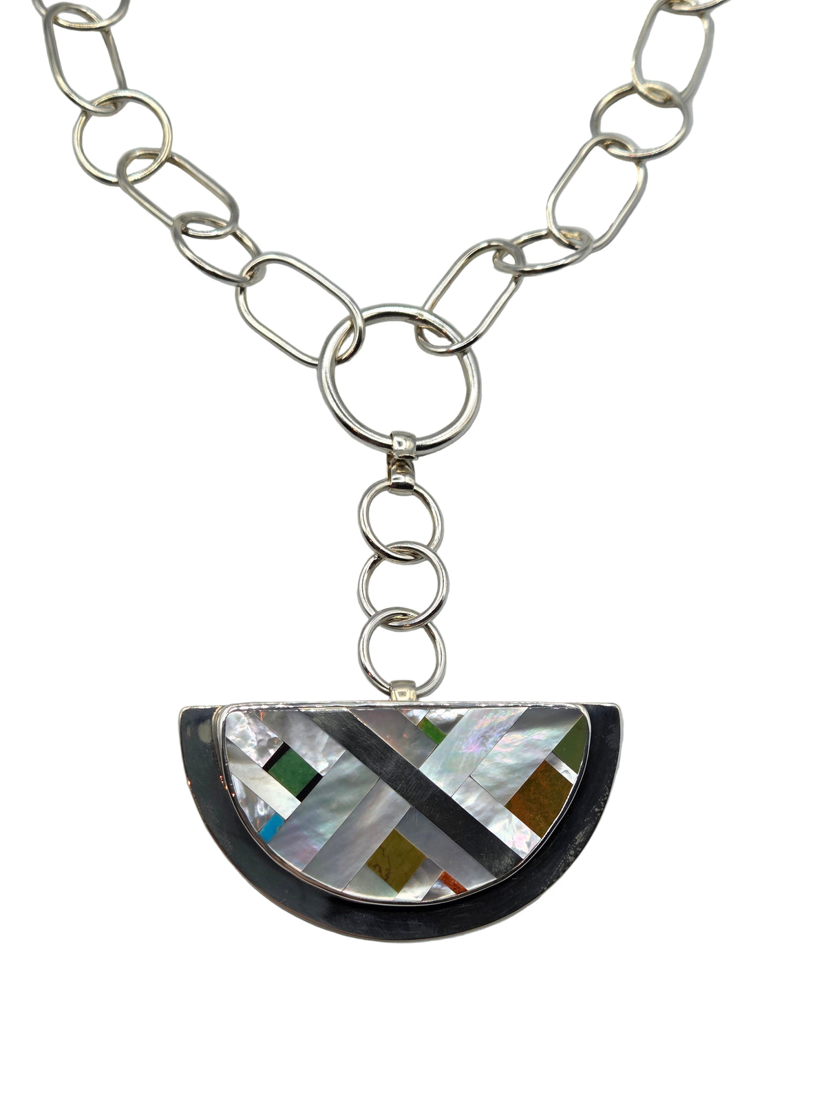 Silver necklace with a semi-circular pendant