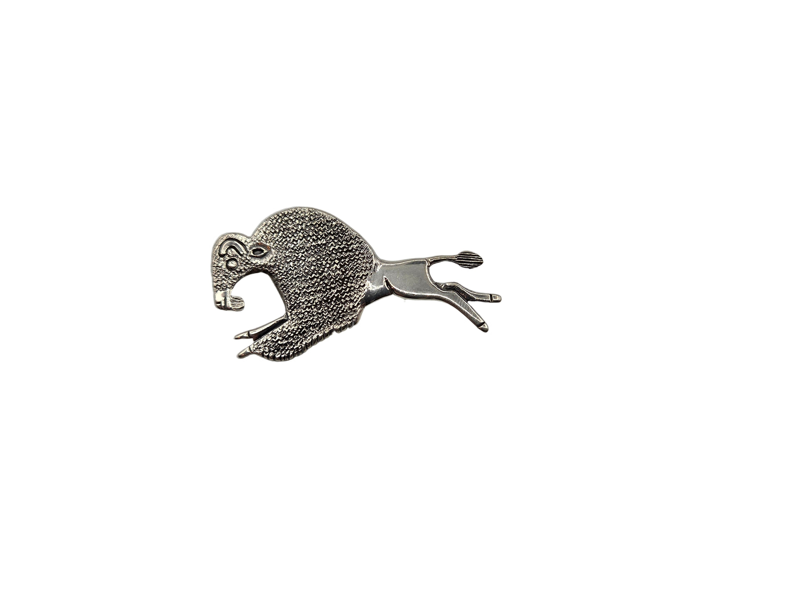 Silver brooch shaped like a buffalo on a white background