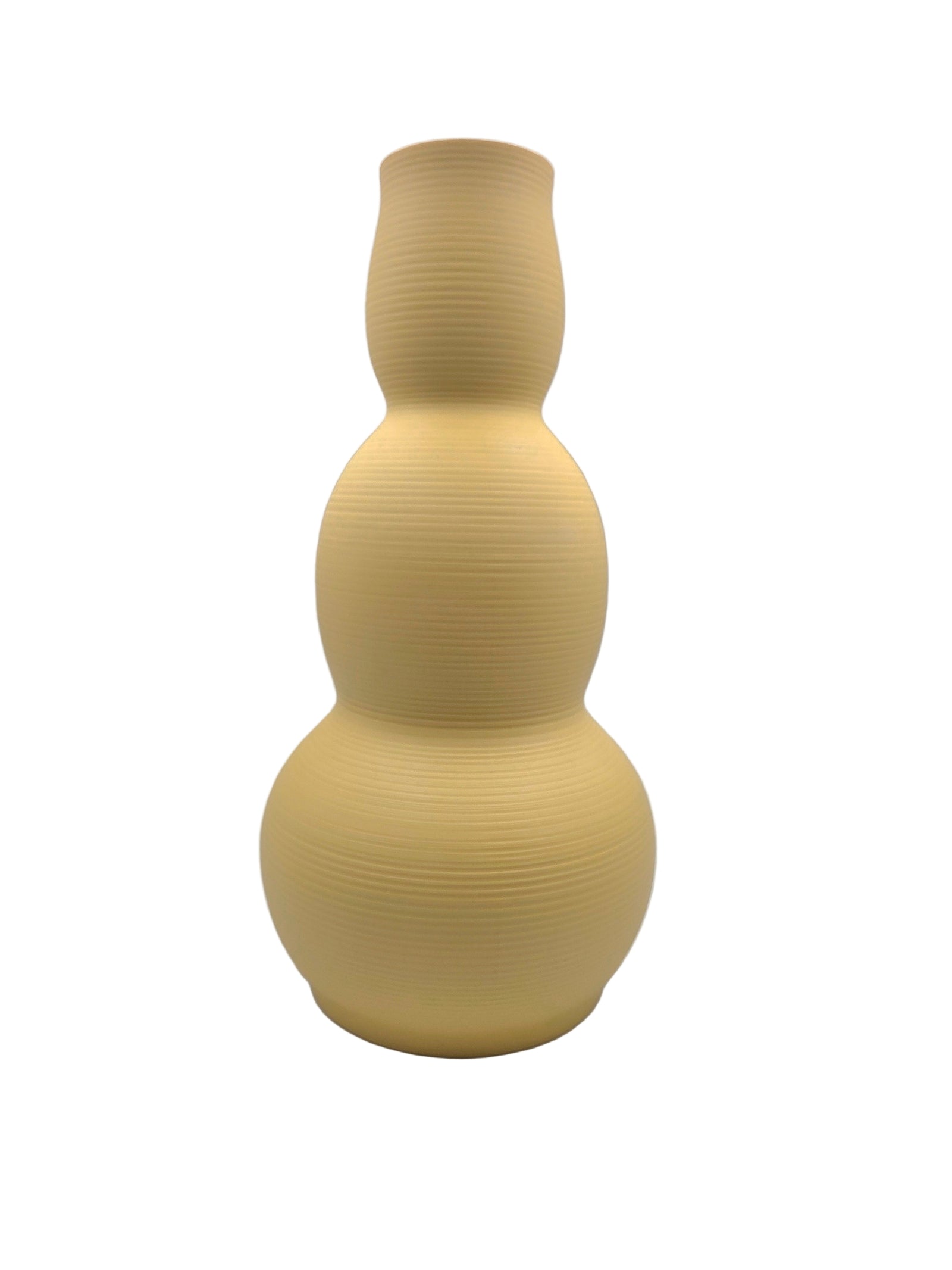 Yellow textured vase on a white background