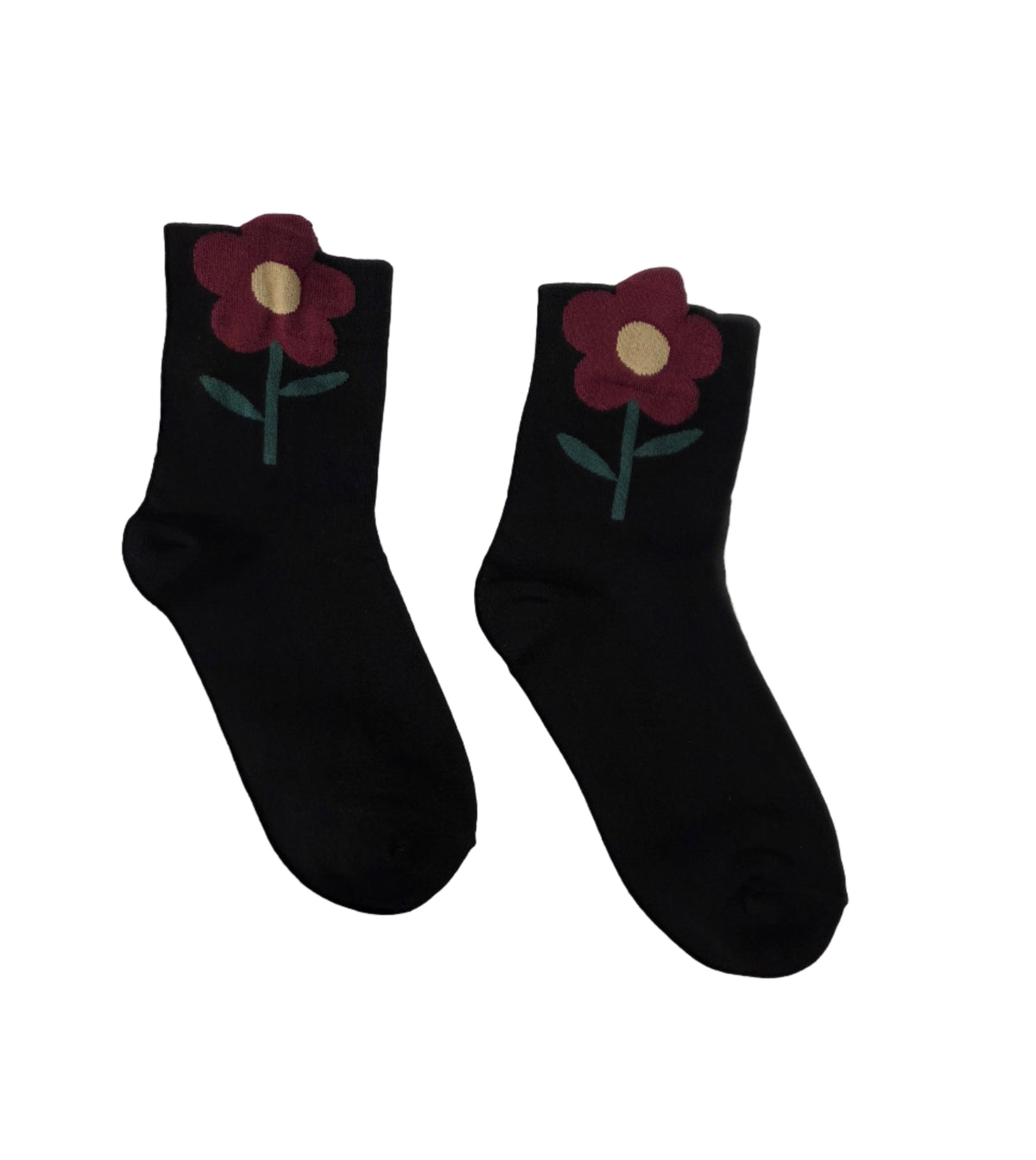 Pair of black socks with floral designs on a white background