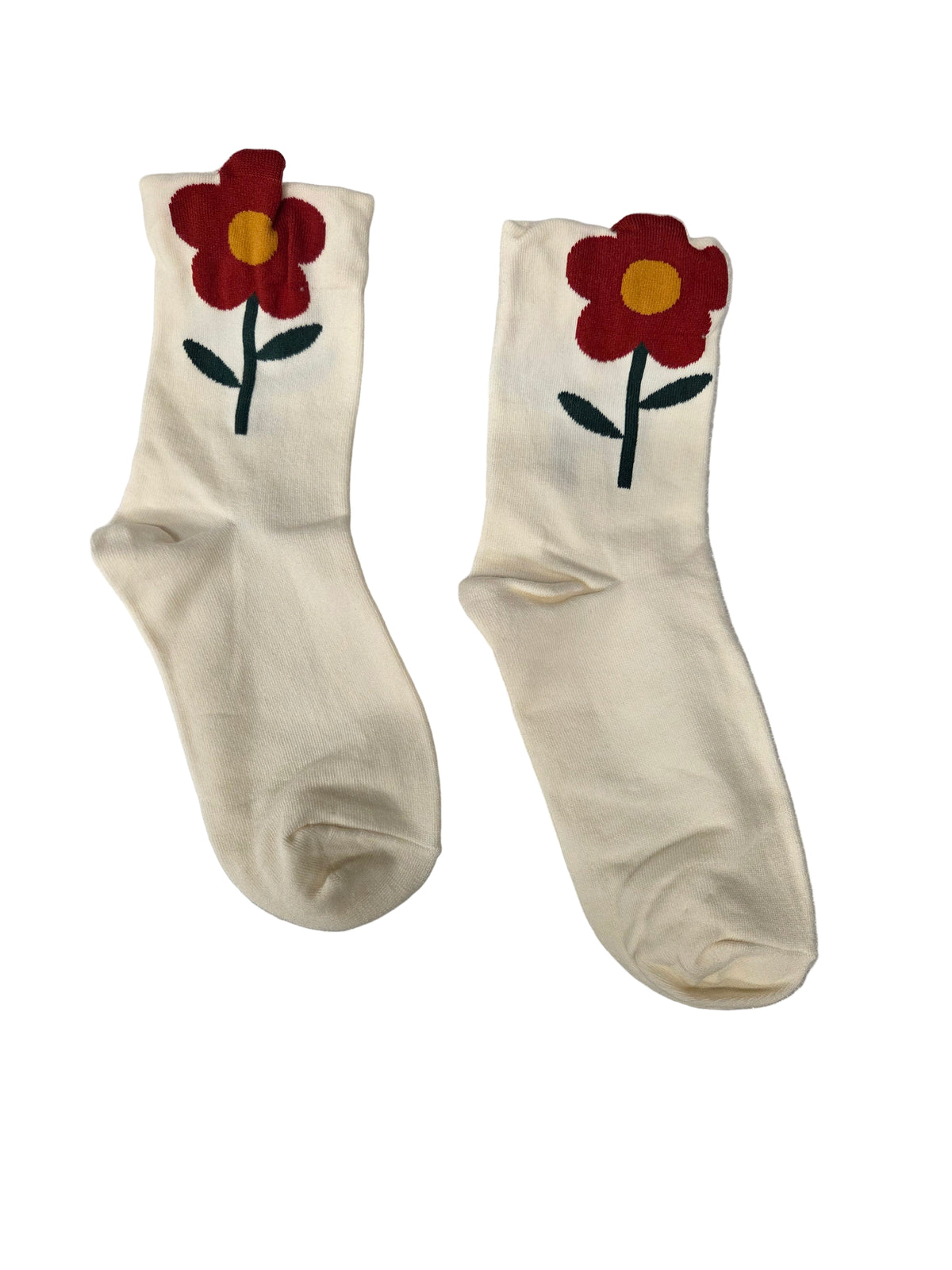 Pair of white socks with red flower designs on a white background