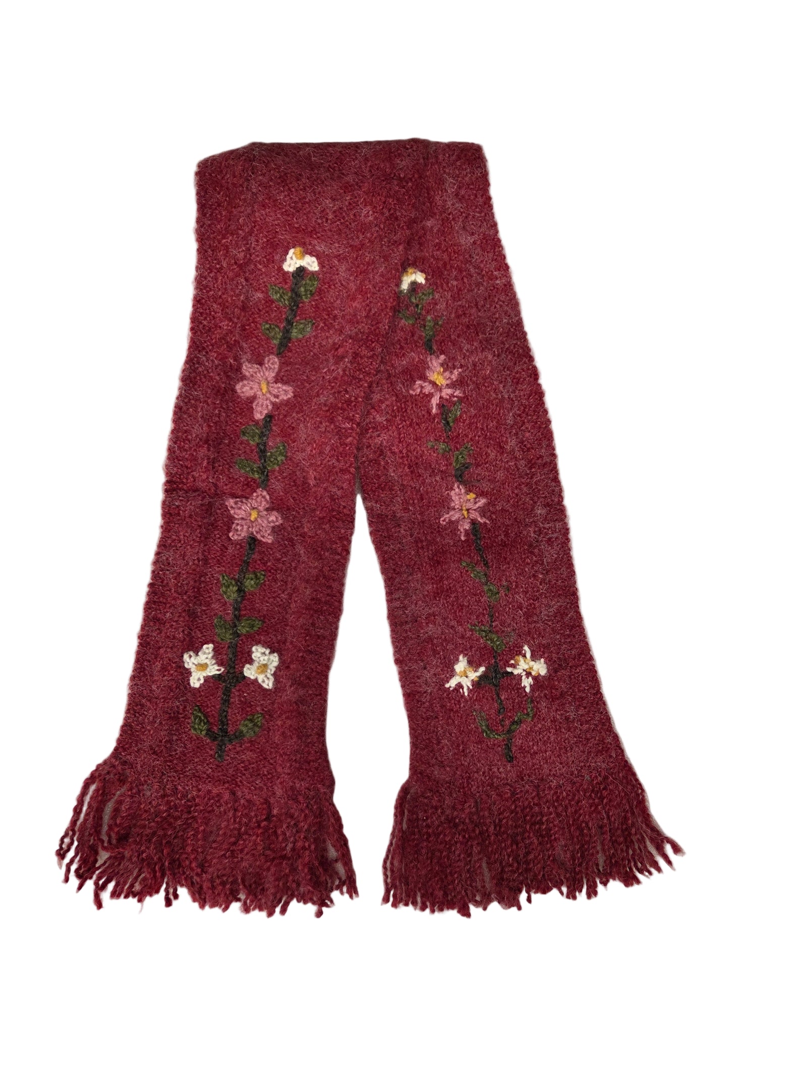Red embroidered scarf with flowers on a white surface