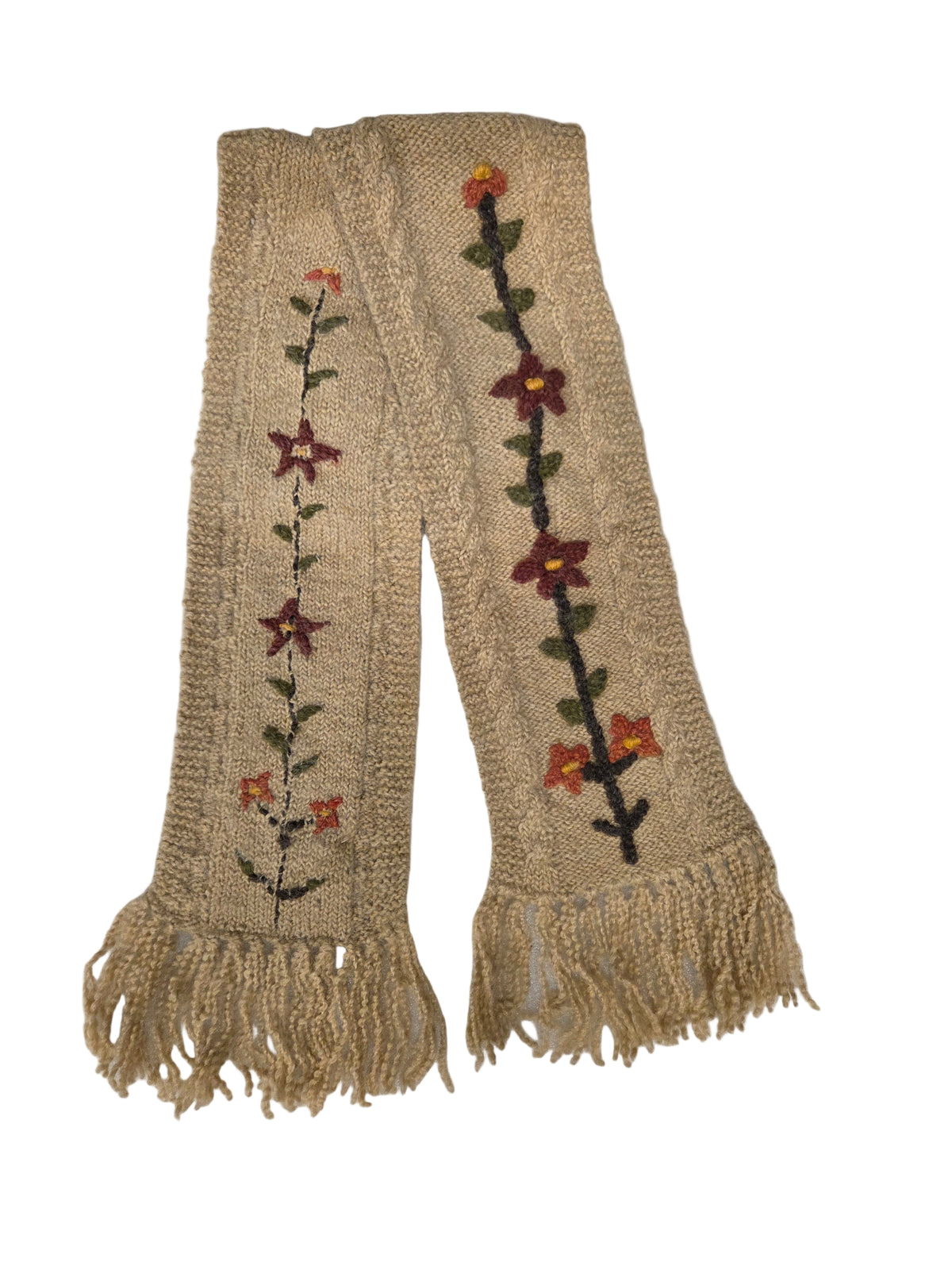 Beige embroidered scarf with flowers on a white surface