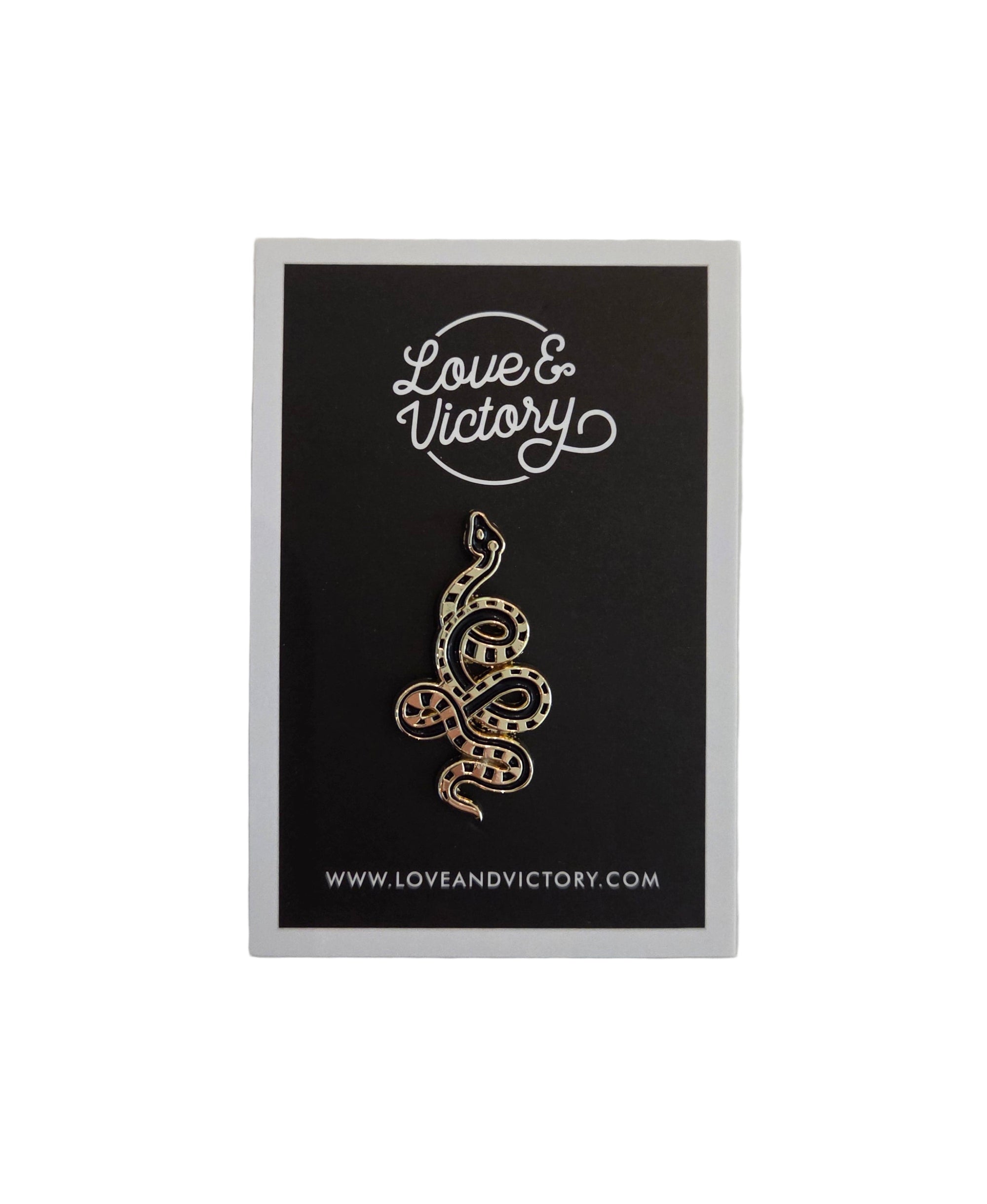 Black card with gold snake on a white background
