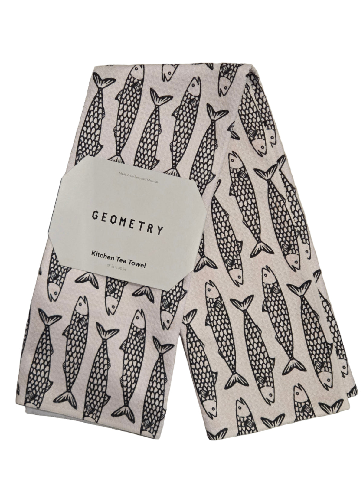 Tea towel with fish pattern and 'Geometry' label on a textured surface