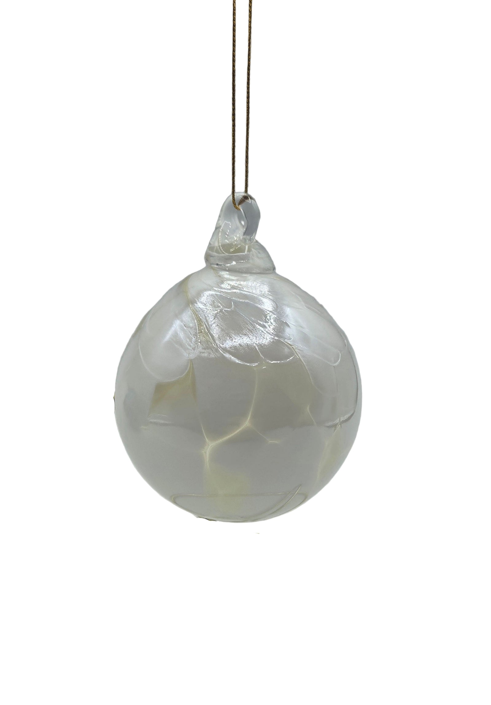 White round ornament hanging against a white background