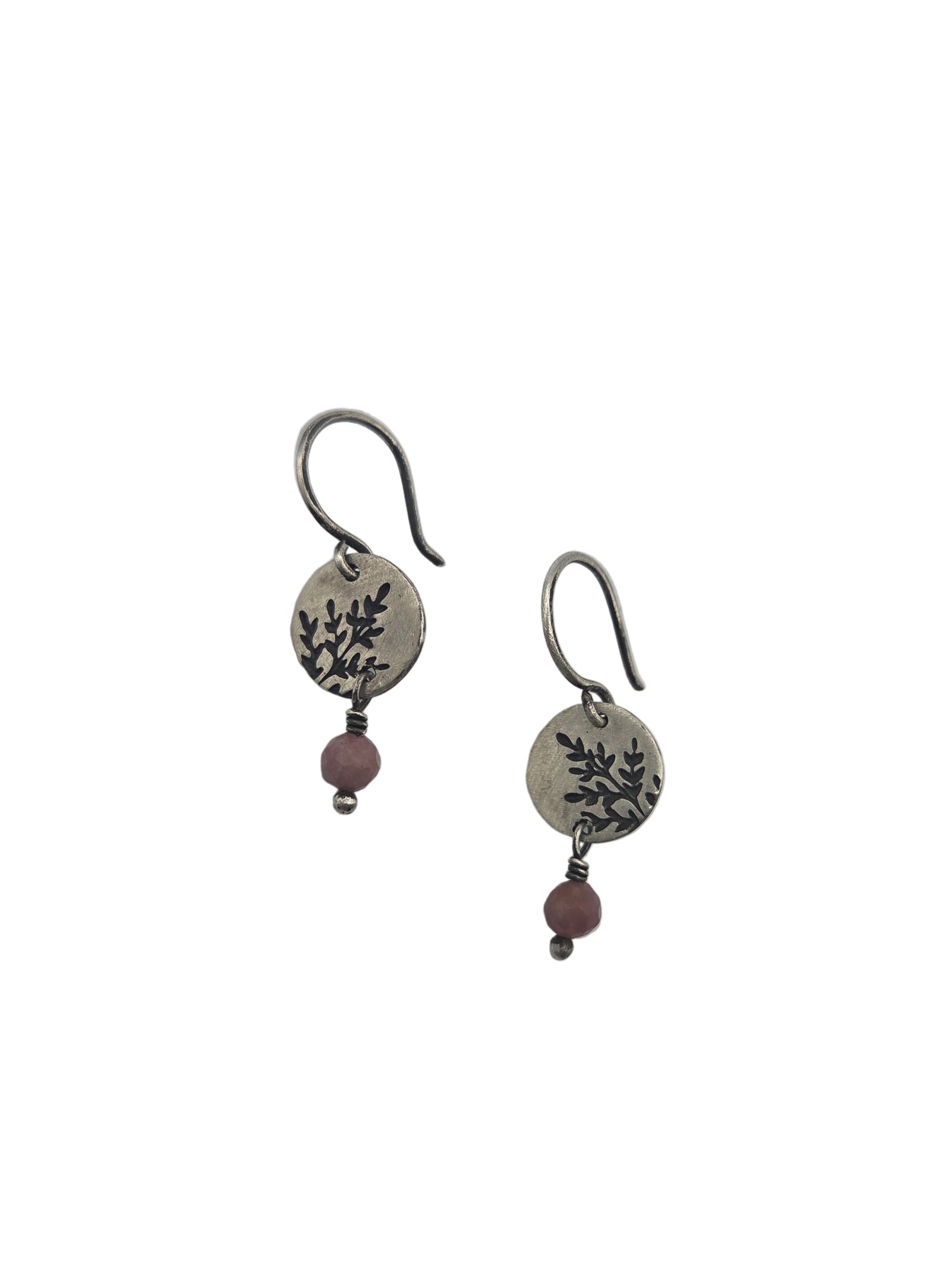 Pair of silver earrings with pink beads on a white background